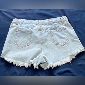 Light blue distressed denim shorts